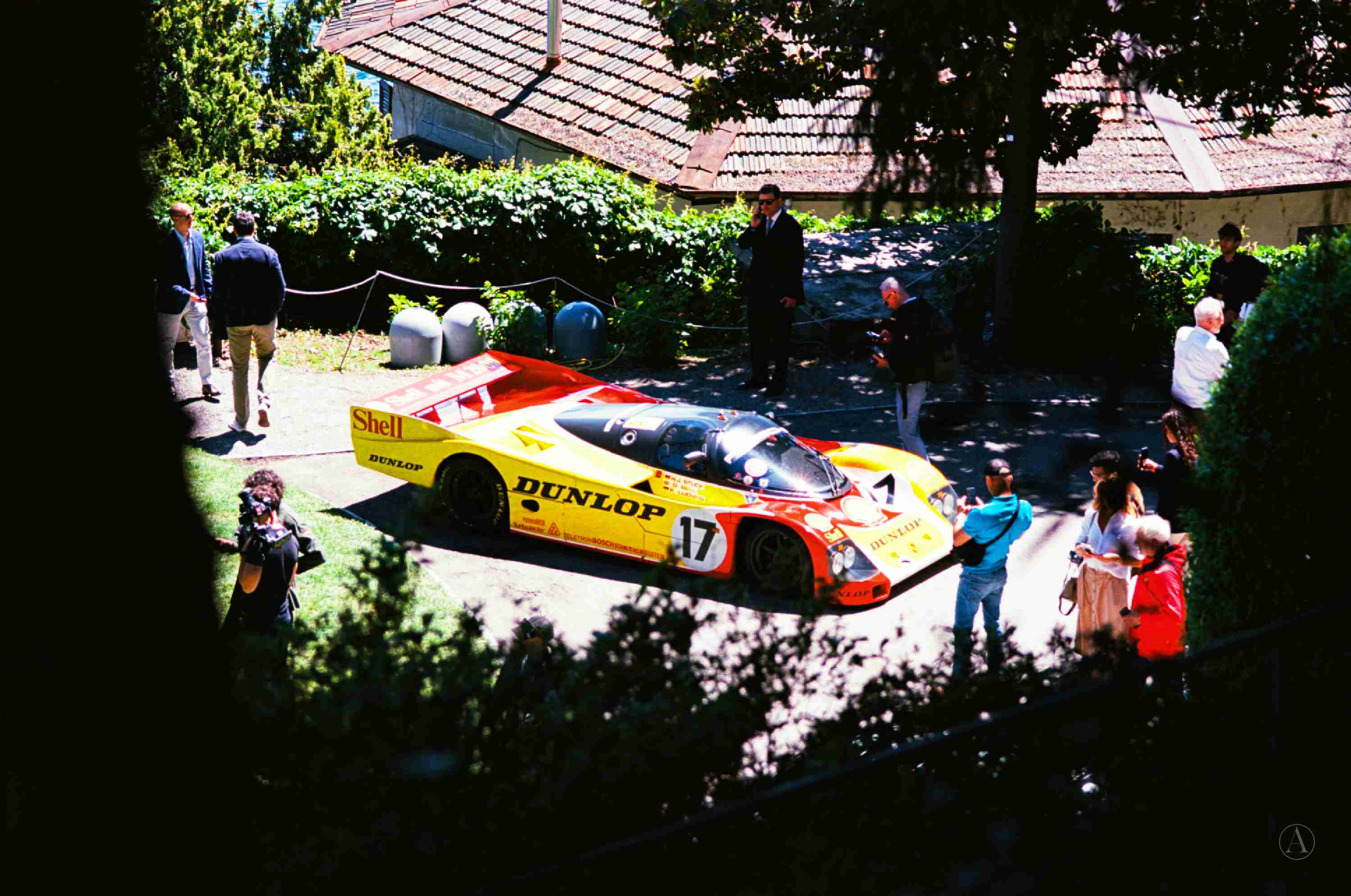 Photograph of Porsche 962-010 on the main approach to Villa Del Grumello